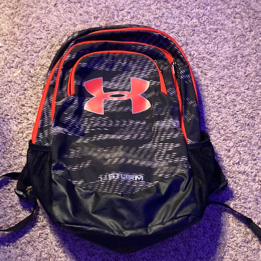 Black and grey Under Armour backpack